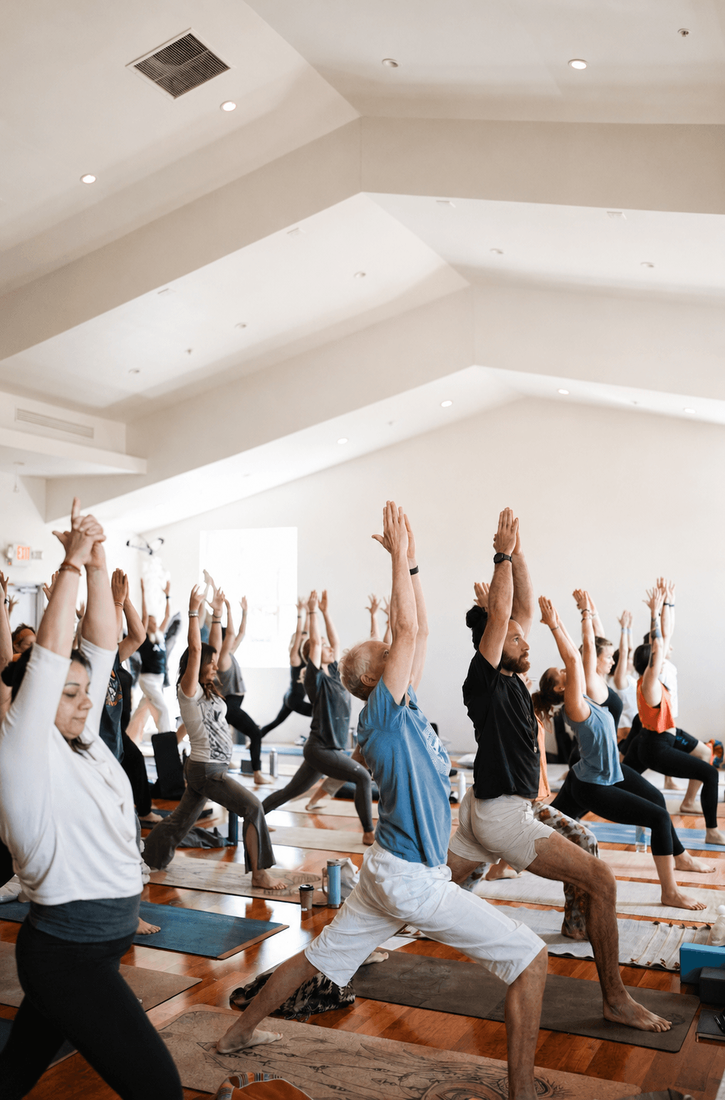 A wide hardwood floor for sun salutations and full-group flow